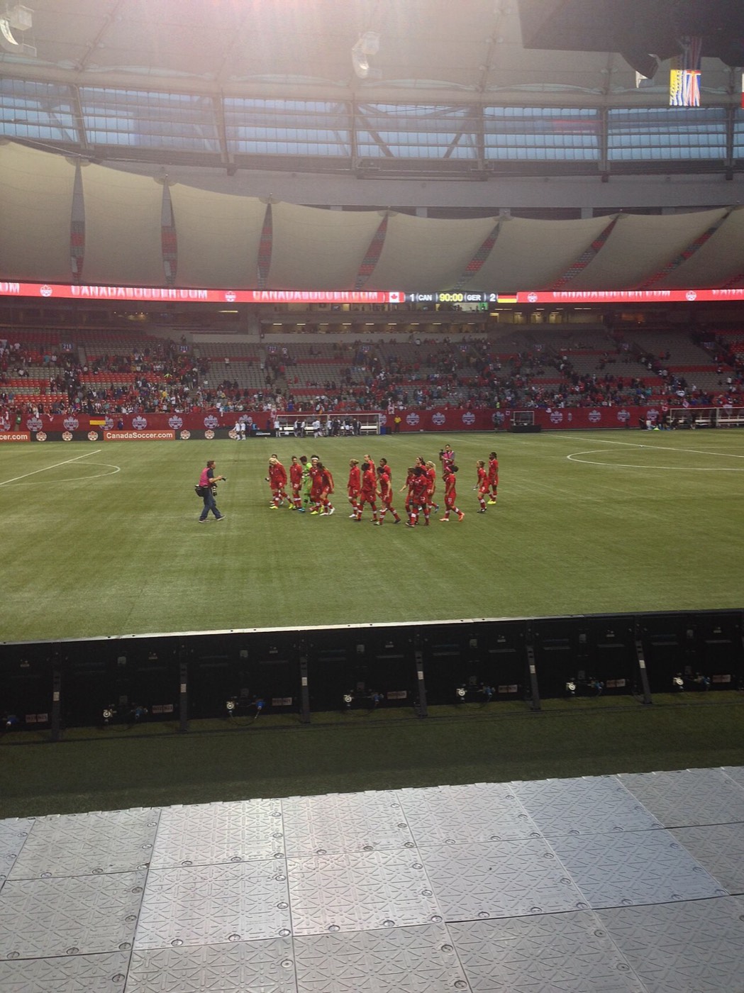 Women's football team saluting supporters