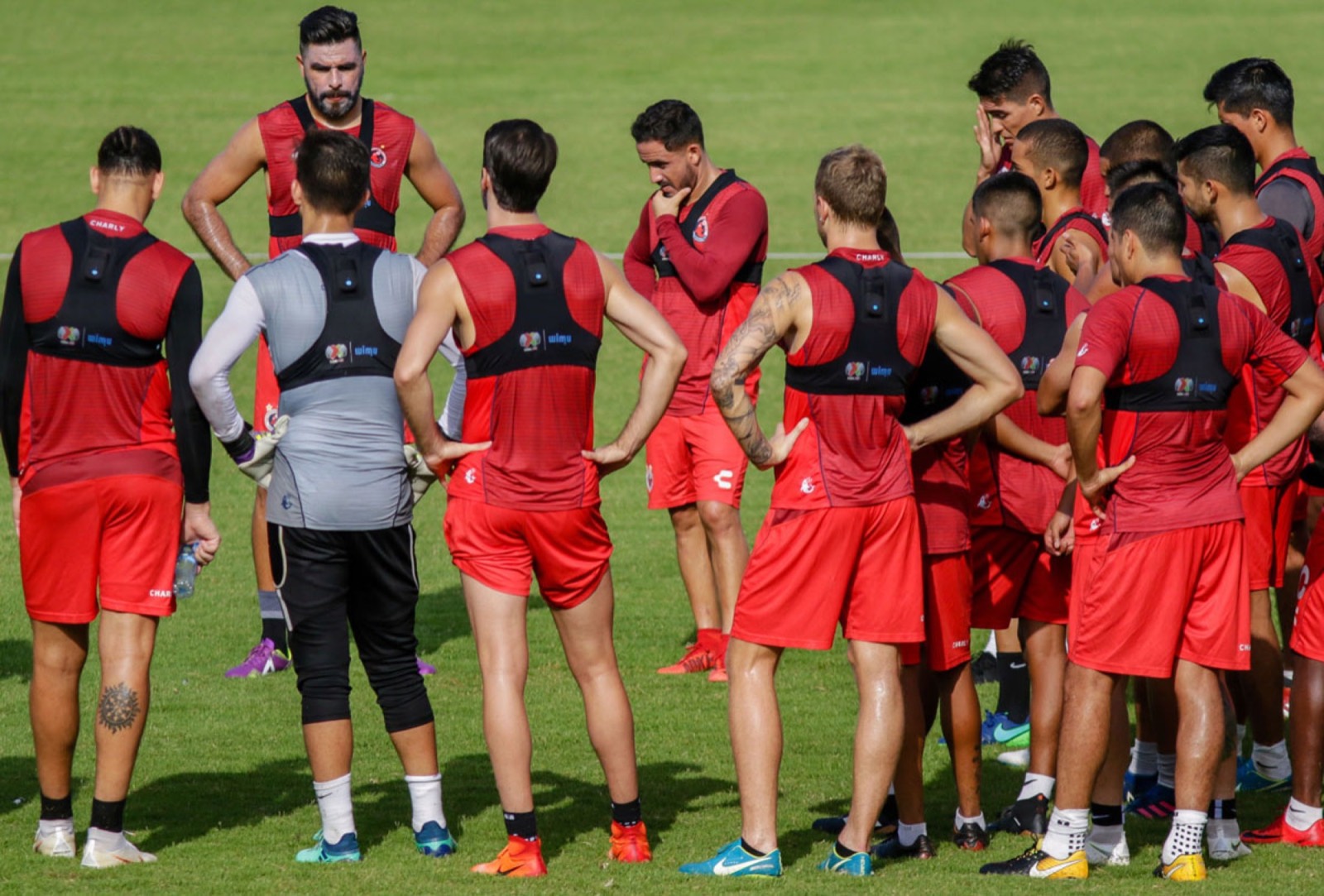 Professional footballers train while wearing GPS devices